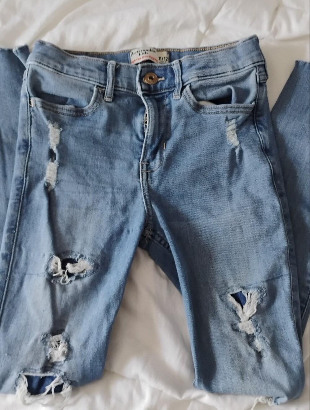 abercrombie kids light blue ripped skinny jeans